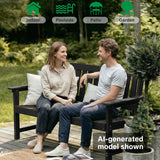 Two people sitting on a 2-person indoor & outdoor bench in a garden setting.