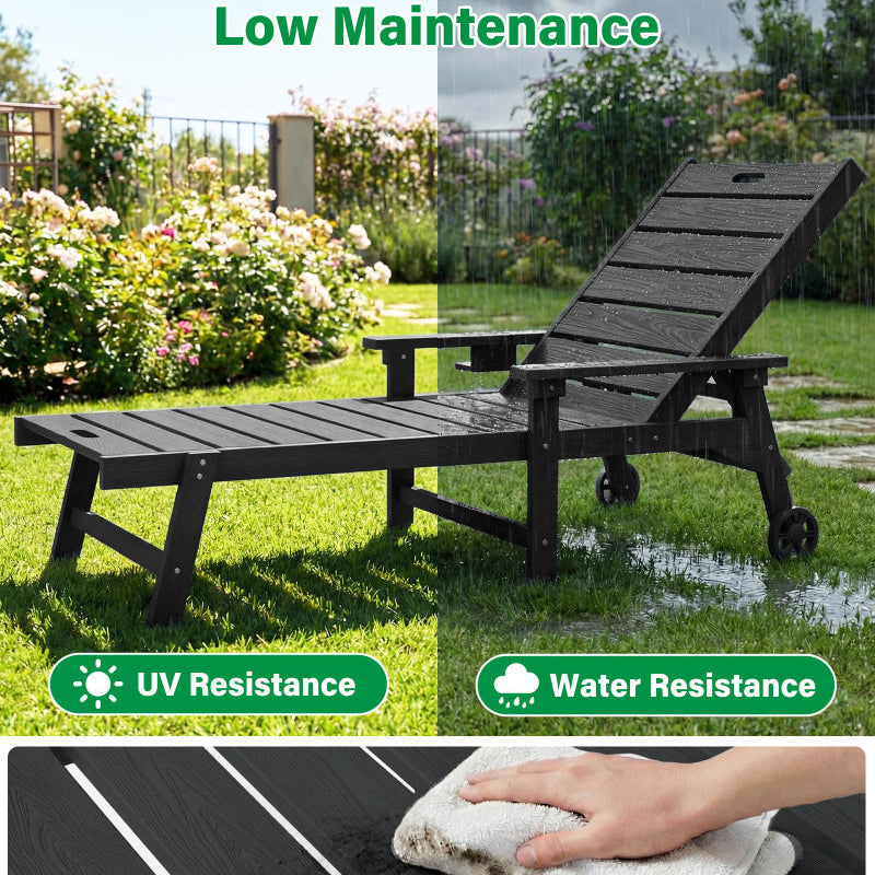Black outdoor lounge chair with wheels in a garden setting, featuring UV resistance and water resistance labels.