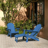 Blue Adirondack chairs and table set on a patio with a building and plants in the background.
