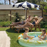 Family enjoying a sunny day by a pool in a garden with a large umbrella.YEFU Lounge Chair Outdoor with Wheels