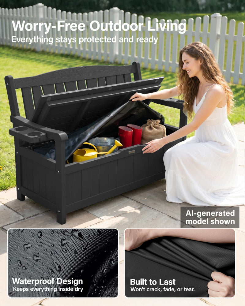 Woman opening a black outdoor storage bench with items inside, set against a white picket fence.
